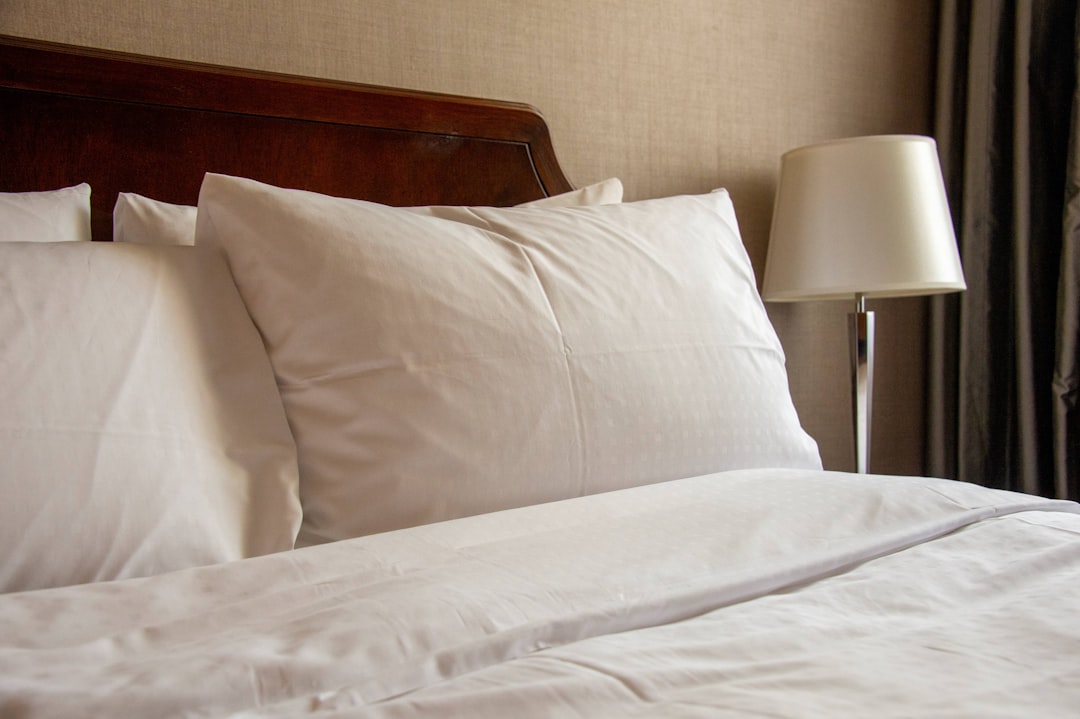 a close up of a pillow on a bed