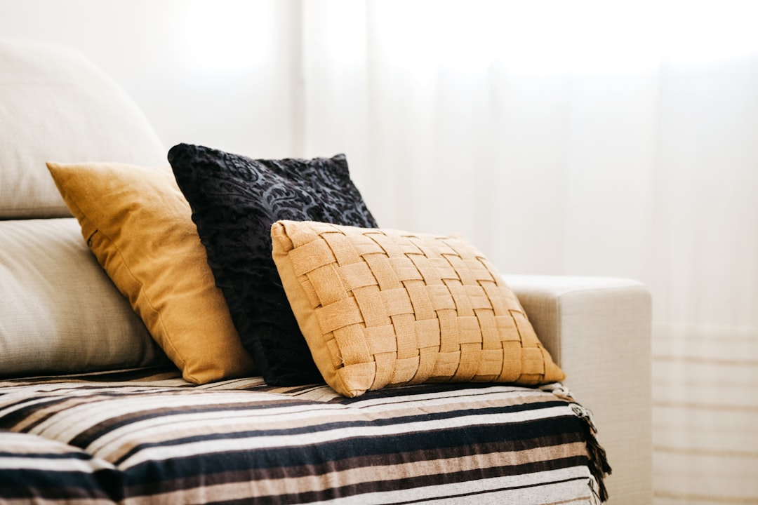 white bed pillow on brown wooden bed frame